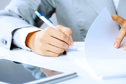 Close up image of businesswoman hands signing documents