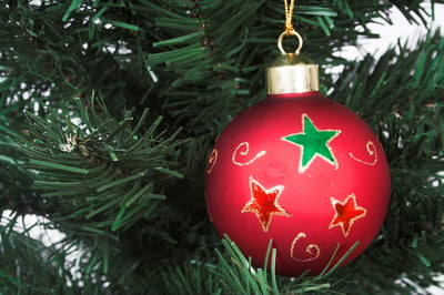 Red christmas ball over a tree